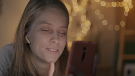 woman using smartphone at night