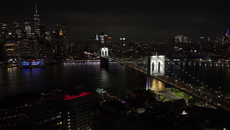 aerial view of the brooklyn bridge at night. shot during the summer of 2024 in 4k.
