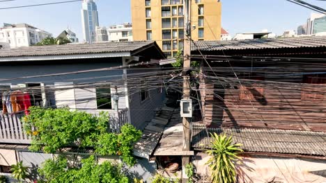 old house surrounded by modern urban development