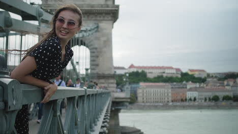 happy woman on the chain bridge in budapest