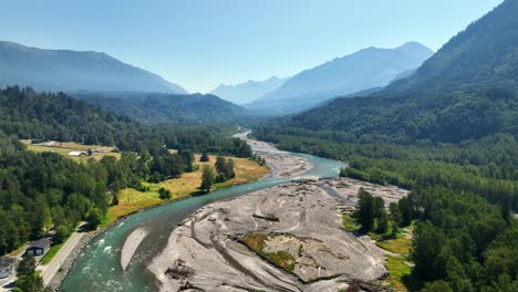 vedder river, chilliwack river with lush green forest and scenic mountains at summer