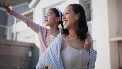 Mom,-girl-child-and-piggy-back-in-sunshine