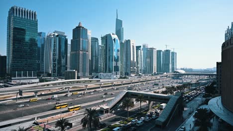 traffic flows along dubai's sheikh zayed road, with a view of jumeirah lake towers in the uae