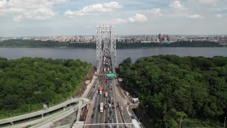 Smooth-aerial-view-of-George-Washington-Bridge-toward-New-York-City,-4K