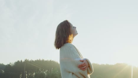 woman contemplating at sunrise