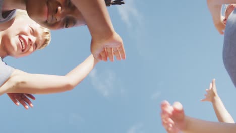 Video-of-happy-diverse-boys-holding-arms-and-clapping-hands