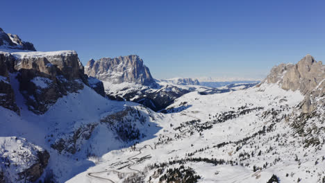 ski slopes with limestone mountain peaks in dolomites, passua, italy