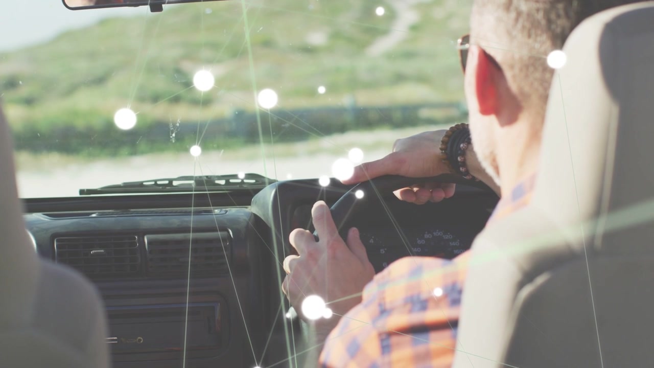 Driver reaching mirror, checking safety, causing auto nodes blooming on windshield, obscuring view