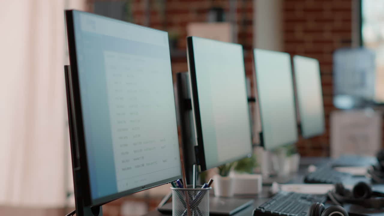 Nobody at customer care workstation with multiple computers