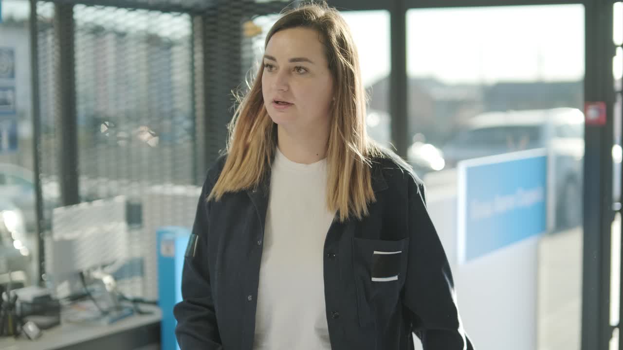 Car Service Manager Walking Through Office