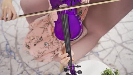 female musician playing violin smiling and happy. opera singer. music teacher.