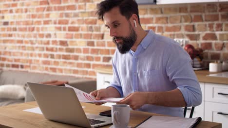 Handheld-video-of-man-during-video-conference-at-home