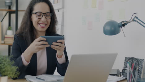 woman using smartphone in a modern office