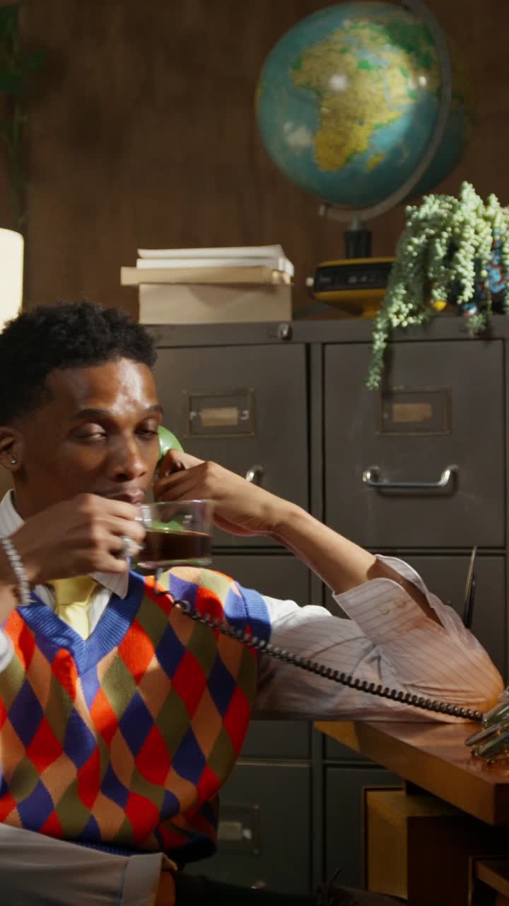 Man Talking on Retro Telephone in Vintage Office