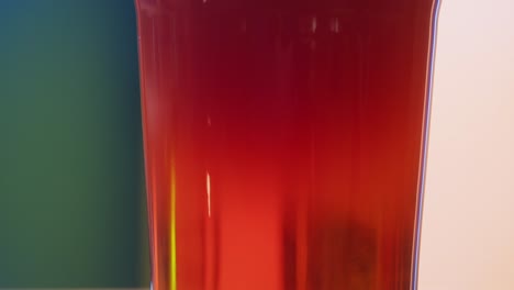 close-up of a glass of red beer