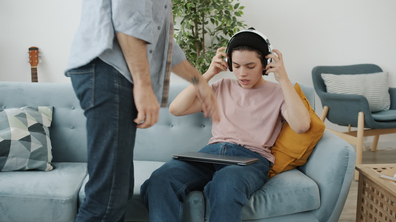 Father and Teenager Having a Discussion
