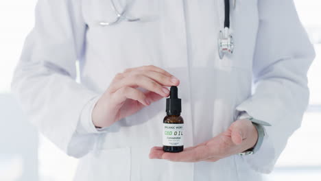 doctor holding a cbd oil bottle