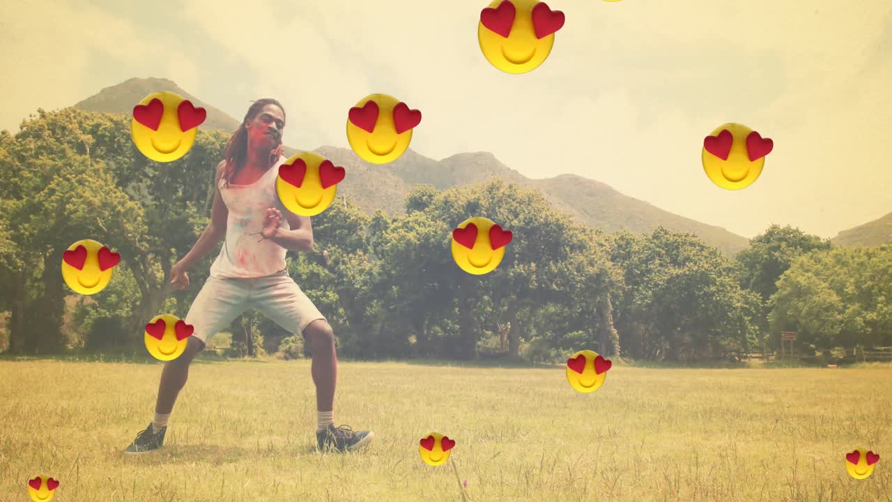 야외 춤을 추는 두 인종 남성 위에 떠다니는 이모티콘의 애니메이션