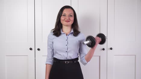 business girl lifting dumbbell and catching leek, symbolism of healthy lifestyle