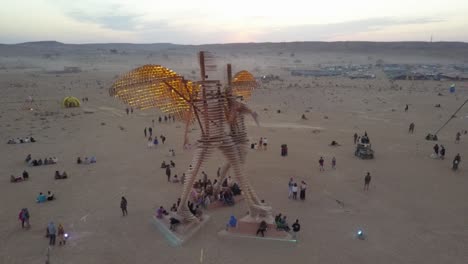 large wooden sculpture at a desert festival