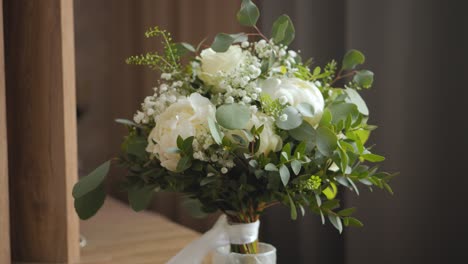 beautiful bouquet of white flowers on the wedding table