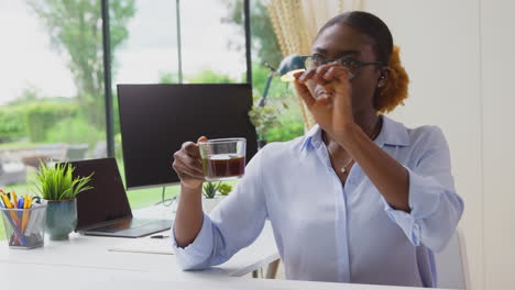 Woman-Working-From-Home-Office-At-Desk-Interacting-With-AR-Technology