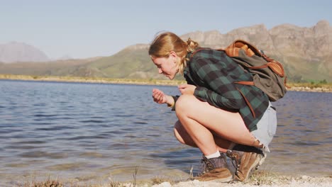 Caucasian-woman-by-a-lake-in-nature.