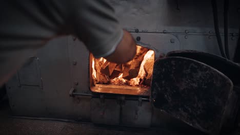 coffee roasting process - probat coffee roasting machine furnace being filled.