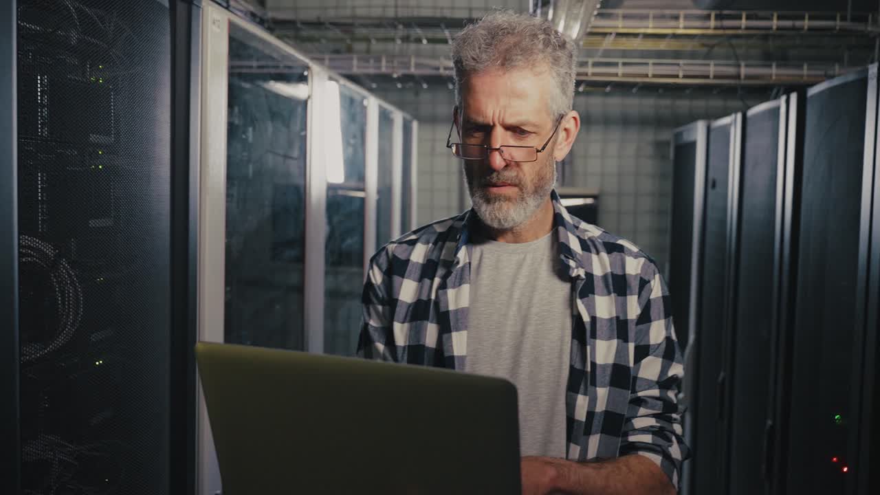 IT Technician working in a server room