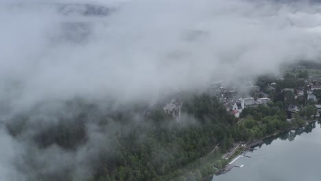 misty mountain town by the lake