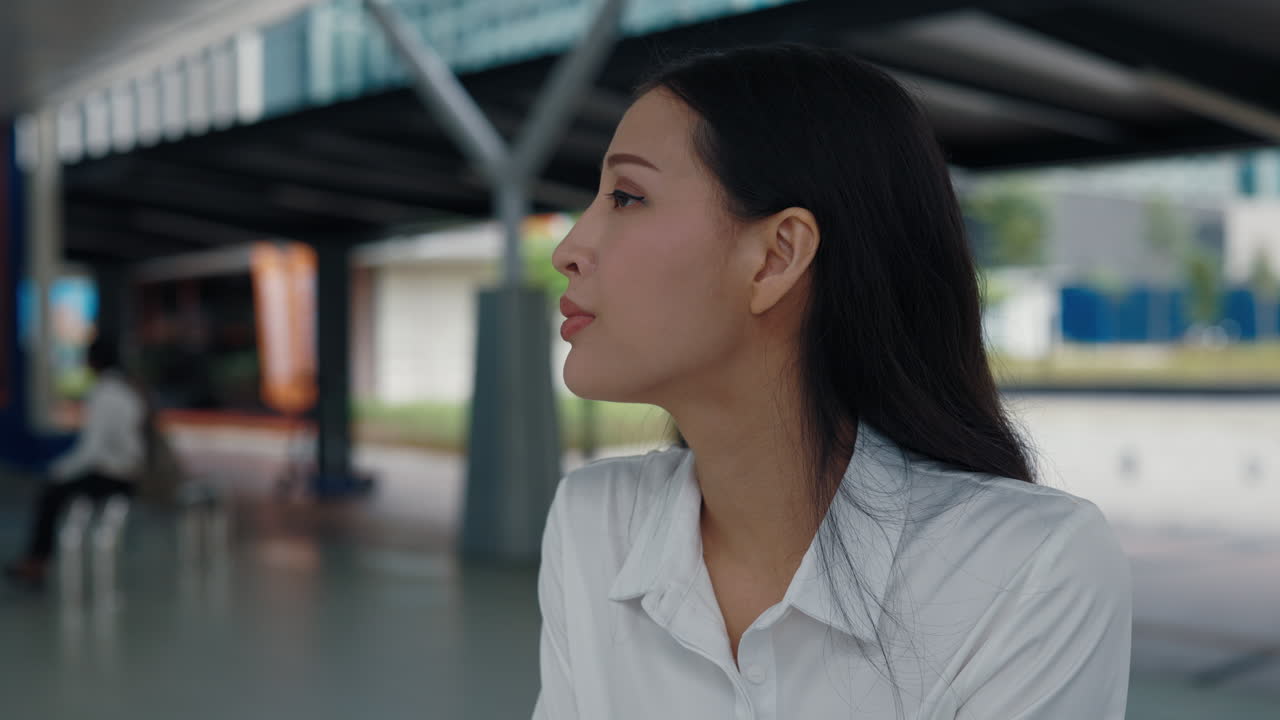 Businesswoman waiting at the station