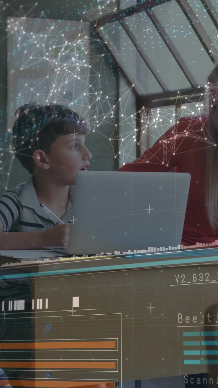Vertical video: Child sitting at laptop adult leaning in starting HUD bars guiding learning