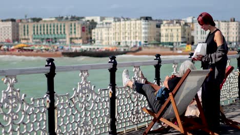 two women enjoying a sunny day by the sea