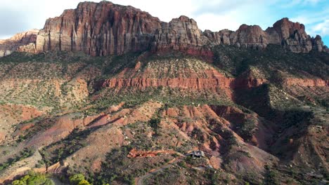 Red-Rock-Cliffs-in-Springdale-Utah,-showing-Layers-and-Erosion--Aerial