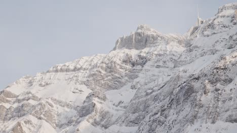 Swiss-Mountain-Saentis-in-the-alps-with-fresh-snow-and-fog