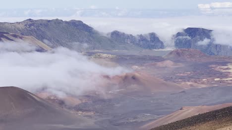 cinematic panning shot of the volcanic crater from the sliding sands trail at the summit of haleakala in maui, hawai'i