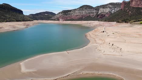 empty reservoir with a ruined church. aerial shot