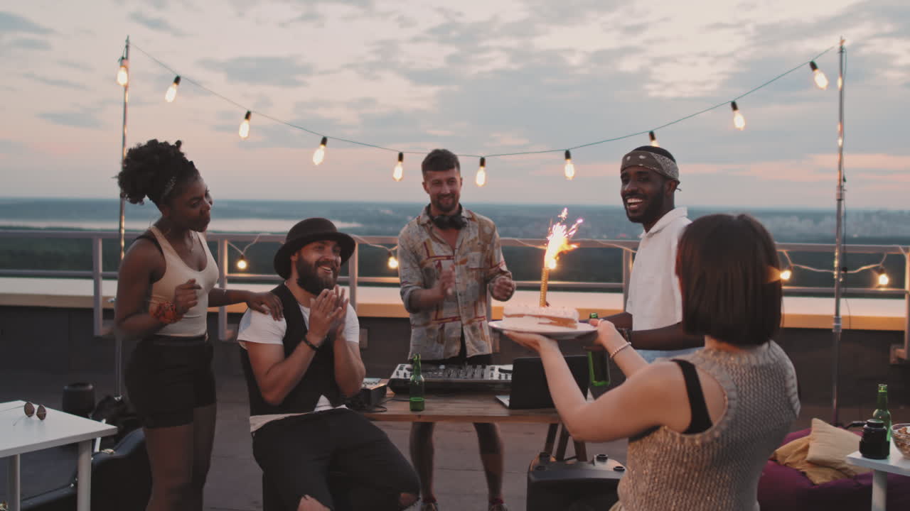 People Celebrating Friends Birthday on Rooftop Terrace