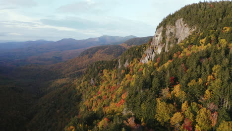 fall foliage aerial flight by cliff in evans notch, located in the white mountains of maine