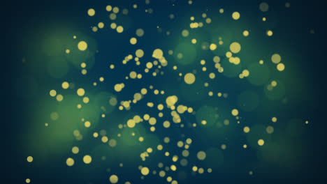 animation of golden dots falling on dark green background