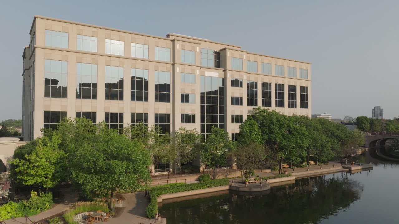 Aerial pan shot of famous Centennial Lakes Office Park building with beautiful architecture at Edina, Minnesota in USA.