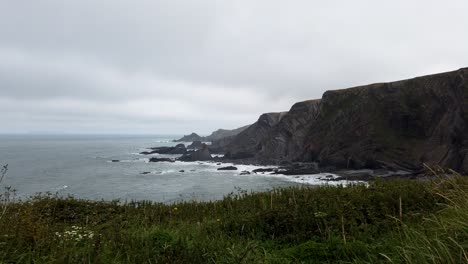 Timelapse-pan-shot-of-uncomfortable-cloudy-weather-Hartland-Quay-Atlantic-Coast-in-North-Devon