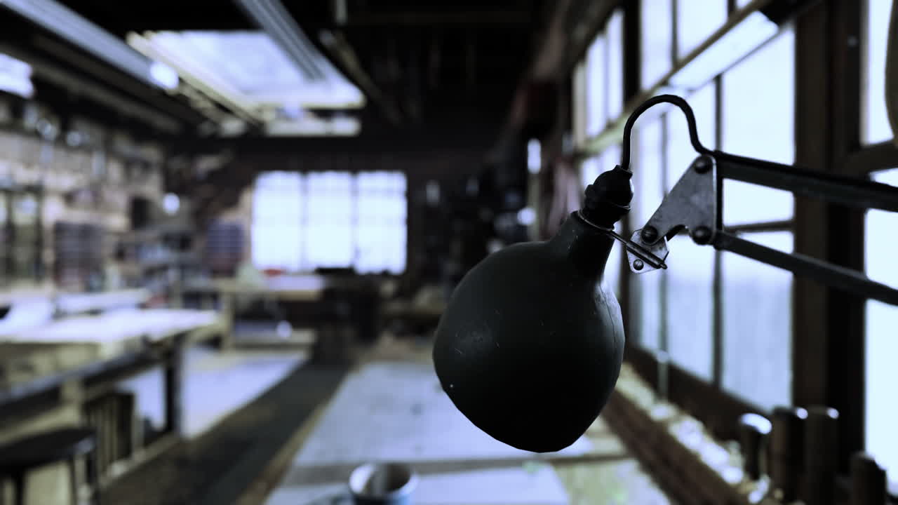 Lighting fixture brightens rustic studio with natural light