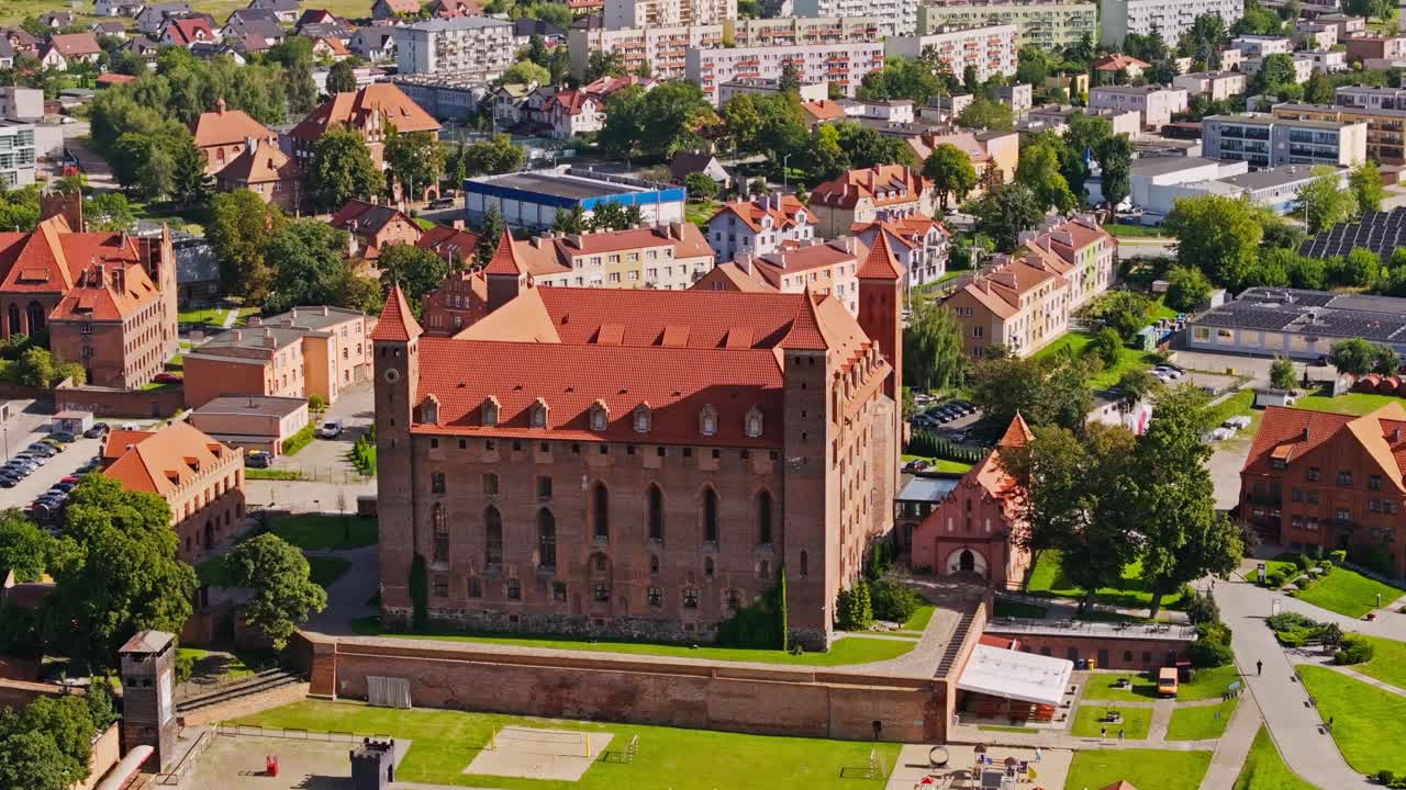 Aerial of Gniew Castle with medieval walls and surrounding town in summer Poland