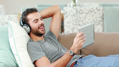 happy young man using his tablet