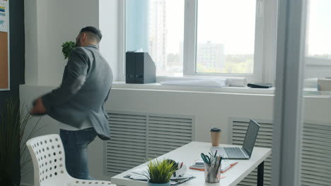 businessman dancing in office