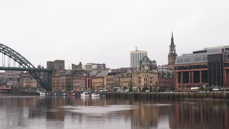 Newcastle-City-Skyline,-Tyne-Bridge-In-Background,-And-Quayside-Busy-Area