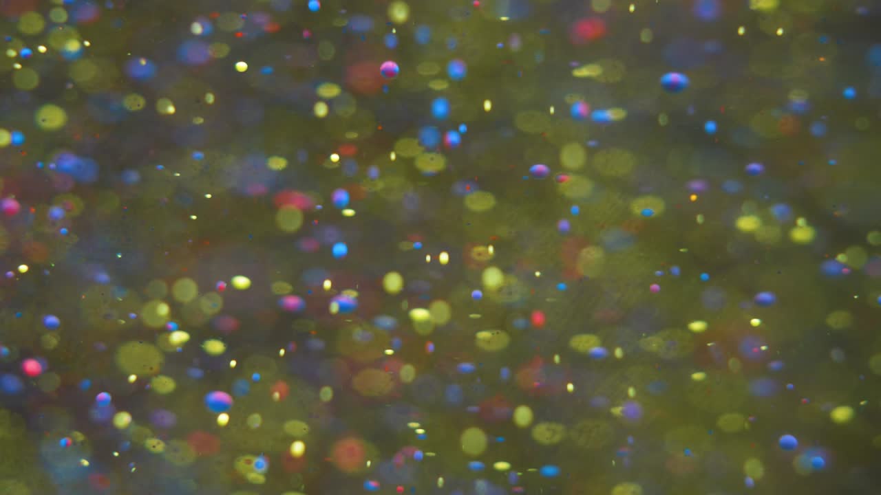 Slow Motion Bright Colors Bubbles Oil Beautiful Paint Universe Color Moving Multicolored Closeup. Acrylic Paint. Fantastic Surface. Abstract Colorful Paint Metamorphosis Structure Colorful Bubbles