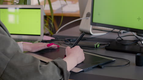 close up of an unrecognizable female graphic designer using digital drawing tablet in the office