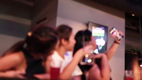 group enjoying drinks and capturing memories